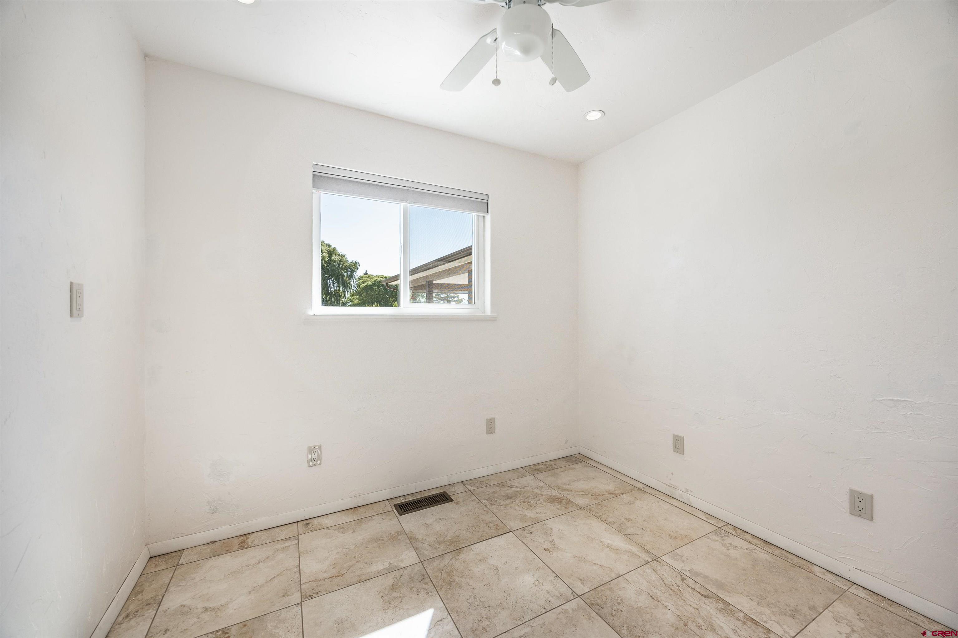 16574 6275th Road Montrose, CO 81403 - Photo 26 of 45 an empty room with a window