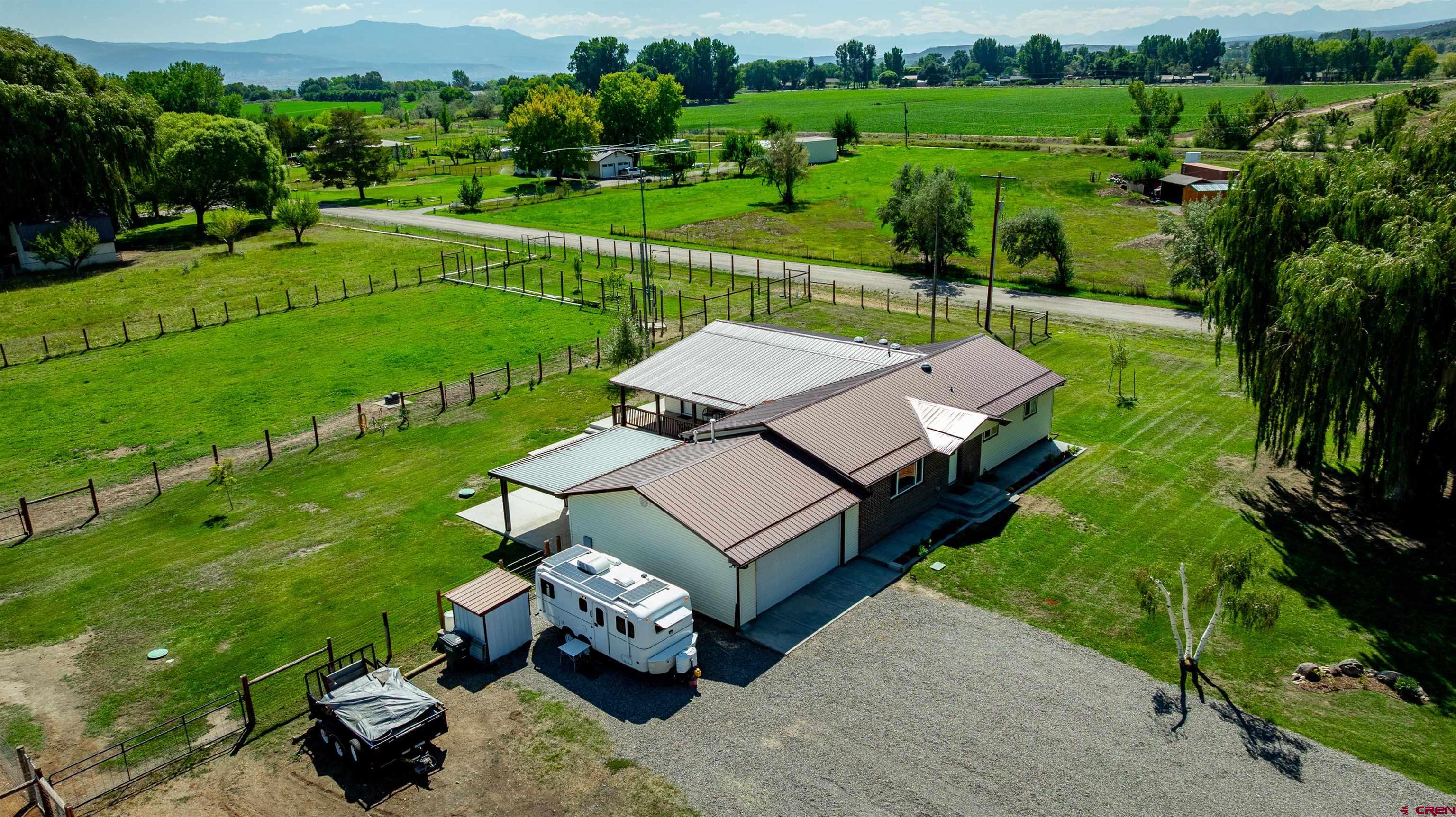 16574 6275th Road Montrose, CO 81403 - Photo 31 of 45 an aerial view of a golf course with chairs