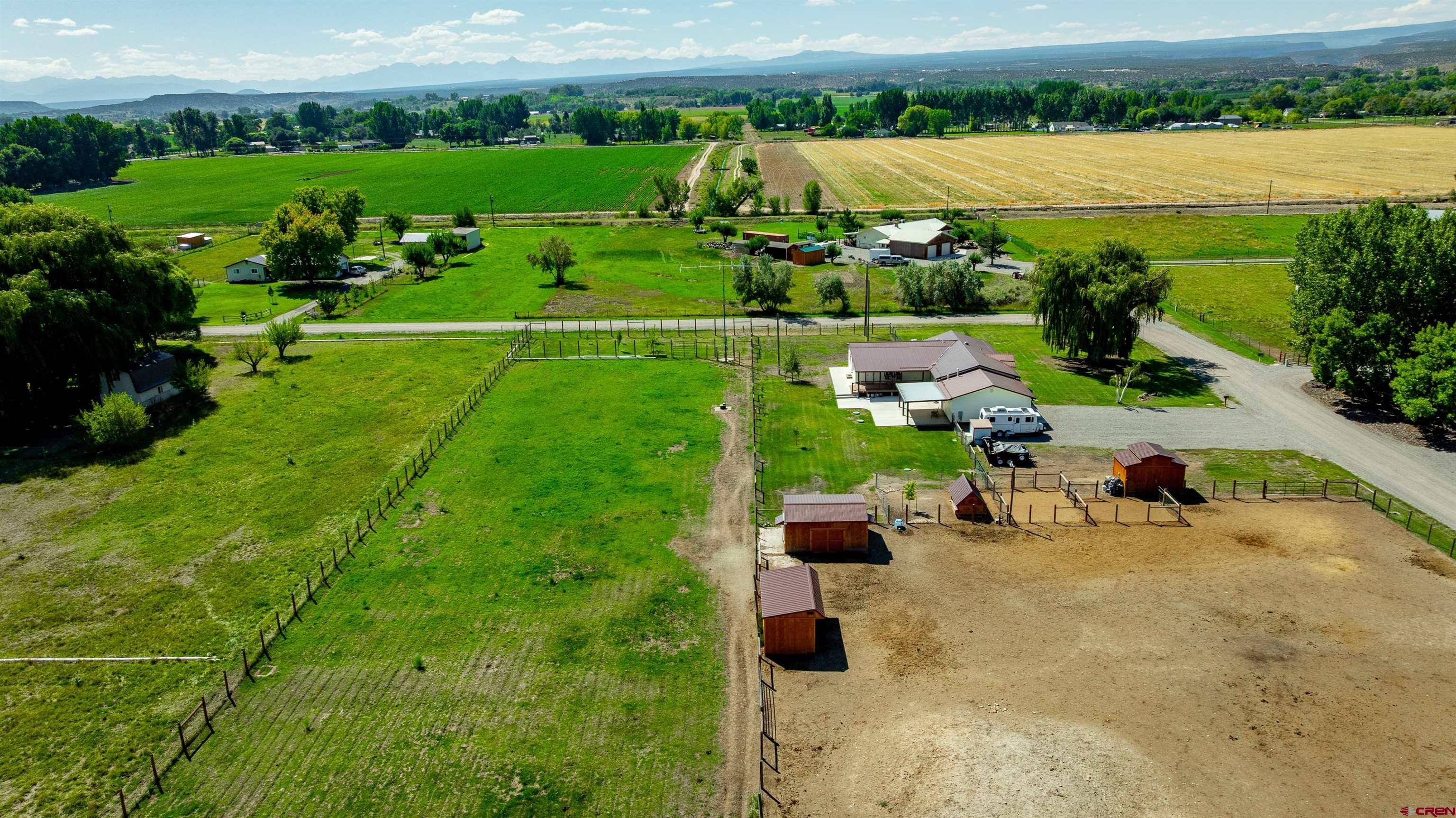 16574 6275th Road Montrose, CO 81403 - Photo 41 of 45 an aerial view of a house with outdoor space and lake view