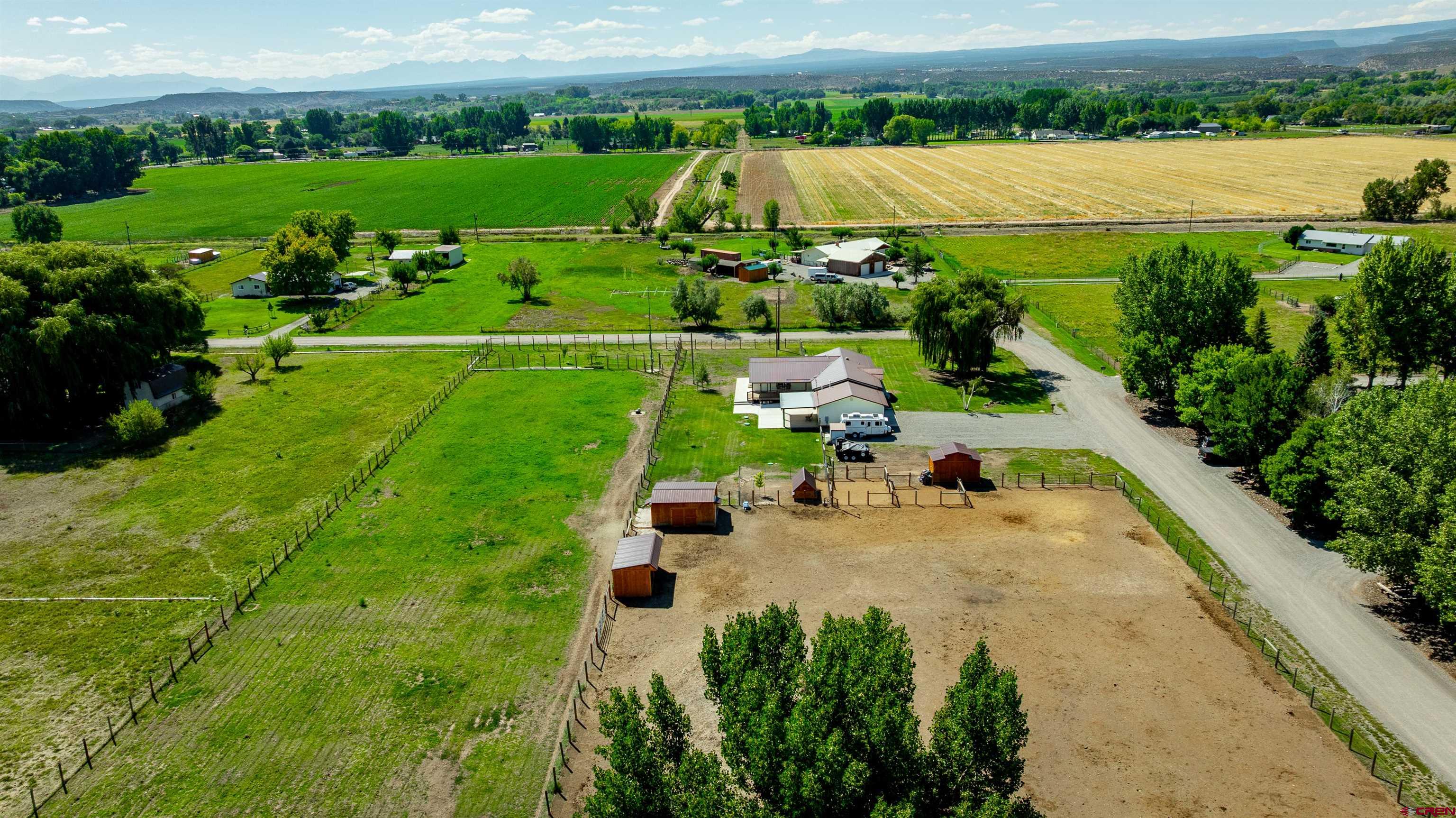 16574 6275th Road Montrose, CO 81403 - Photo 42 of 45 an aerial view of a houses with outdoor space and garden