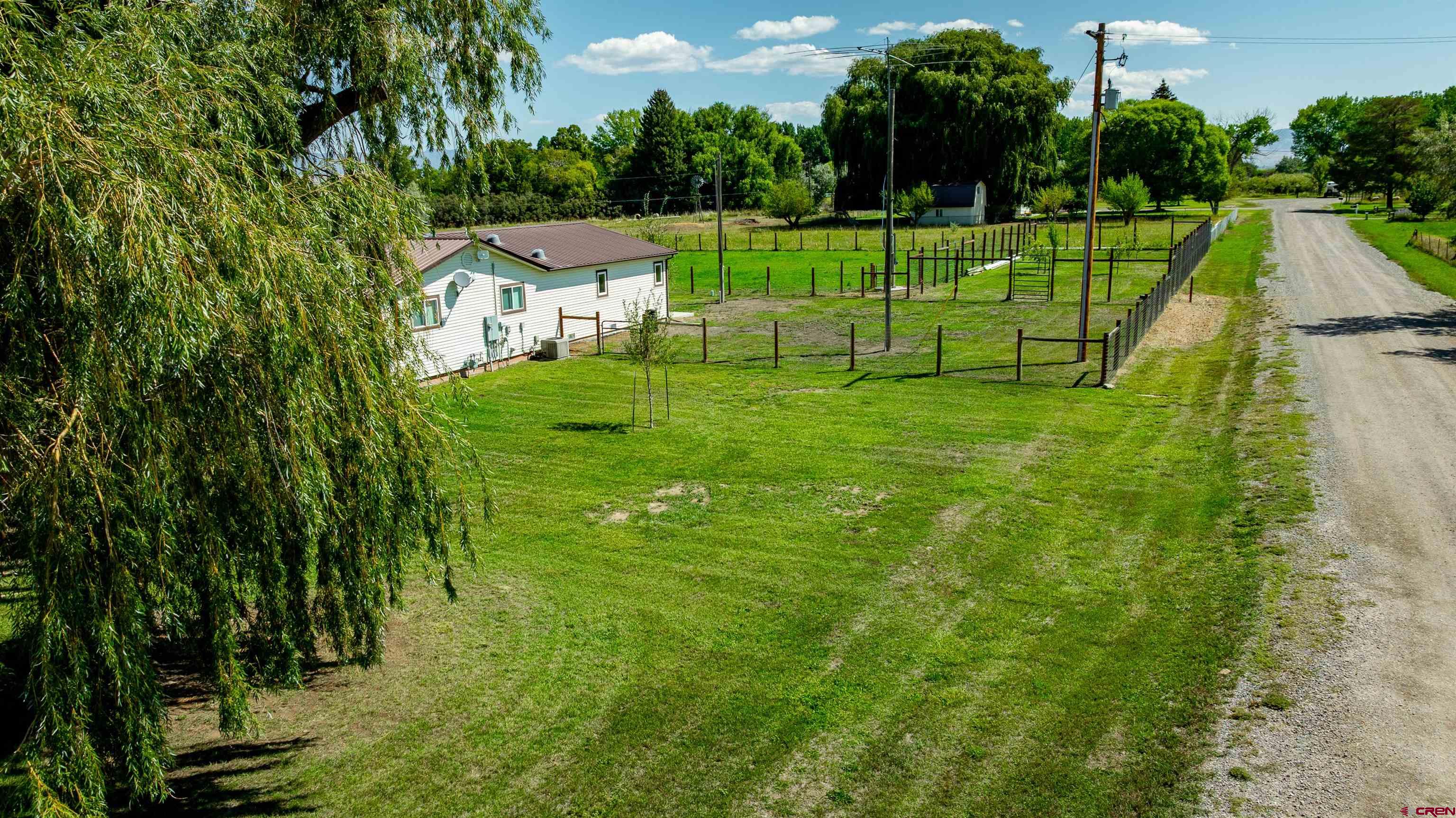 16574 6275th Road Montrose, CO 81403 - Photo 45 of 45 a view of a park with swings and a palm tree