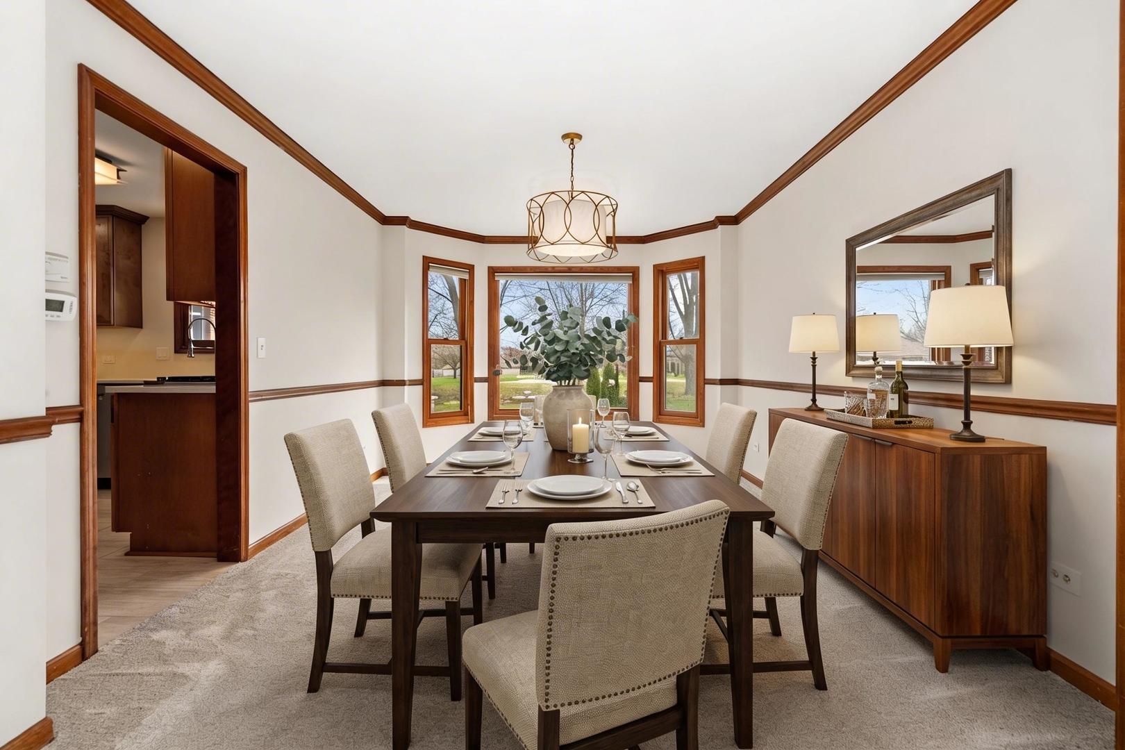 225 Fairway Drive Prospect Heights, IL 60070 - Photo 11 of 57 a view of a dining room with furniture window and wooden floor