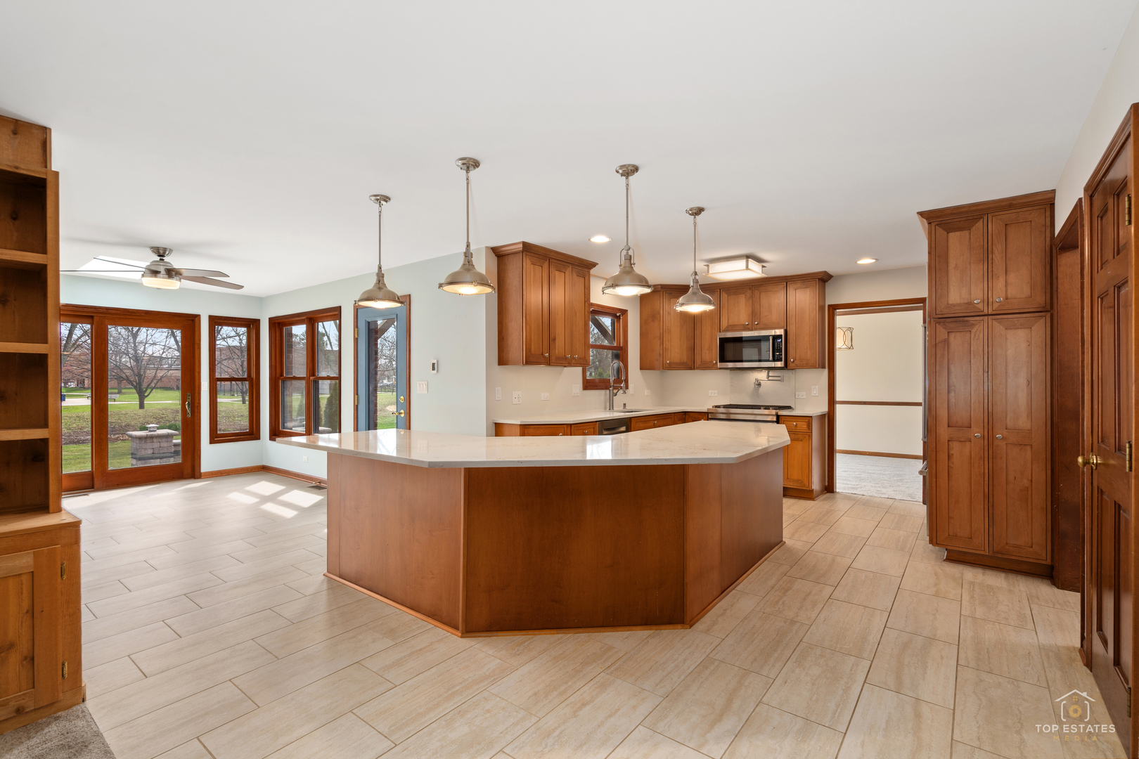 225 Fairway Drive Prospect Heights, IL 60070 - Photo 14 of 57 a large kitchen with kitchen island granite countertop a large counter top and stainless steel appliances