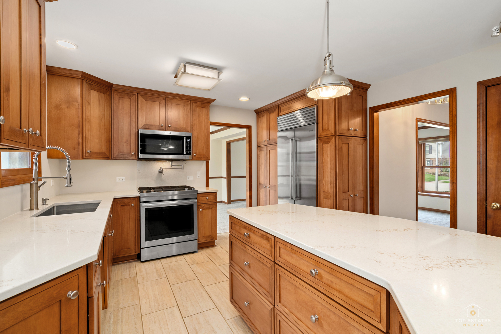 225 Fairway Drive Prospect Heights, IL 60070 - Photo 17 of 57 a kitchen with stainless steel appliances granite countertop a sink stove and refrigerator