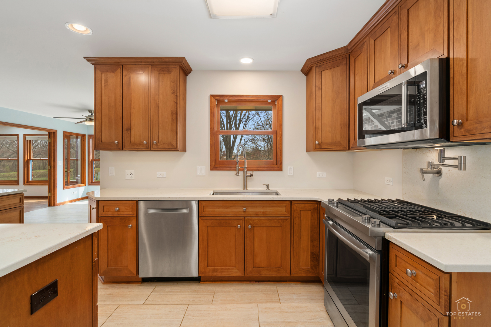 225 Fairway Drive Prospect Heights, IL 60070 - Photo 18 of 57 a kitchen with stainless steel appliances wooden cabinets and a stove top oven