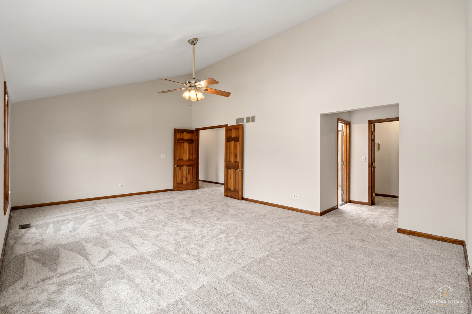 225 Fairway Drive Prospect Heights, IL 60070 - Photo 30 of 57 an empty room with chandelier fan and closet
