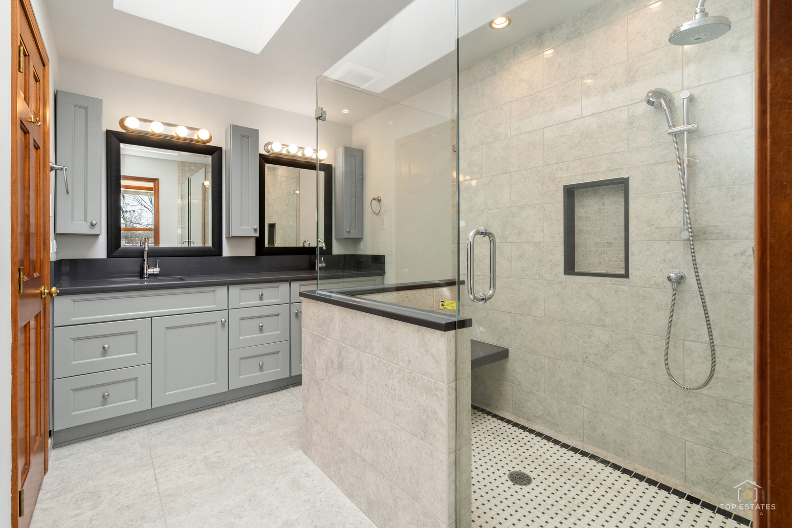 225 Fairway Drive Prospect Heights, IL 60070 - Photo 31 of 57 a spacious bathroom with a granite countertop sink a mirror and a