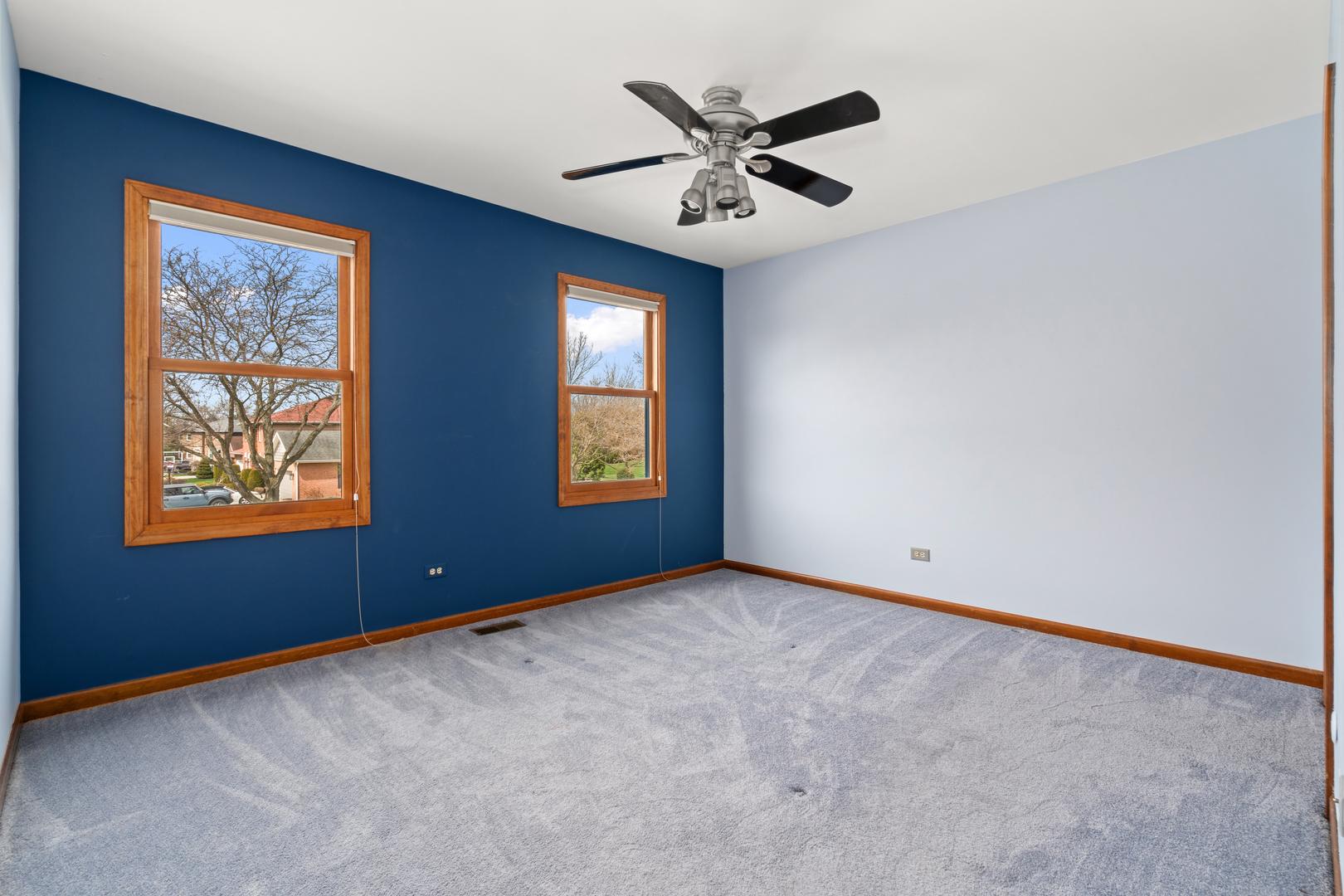 225 Fairway Drive Prospect Heights, IL 60070 - Photo 36 of 57 an empty room with windows and fan