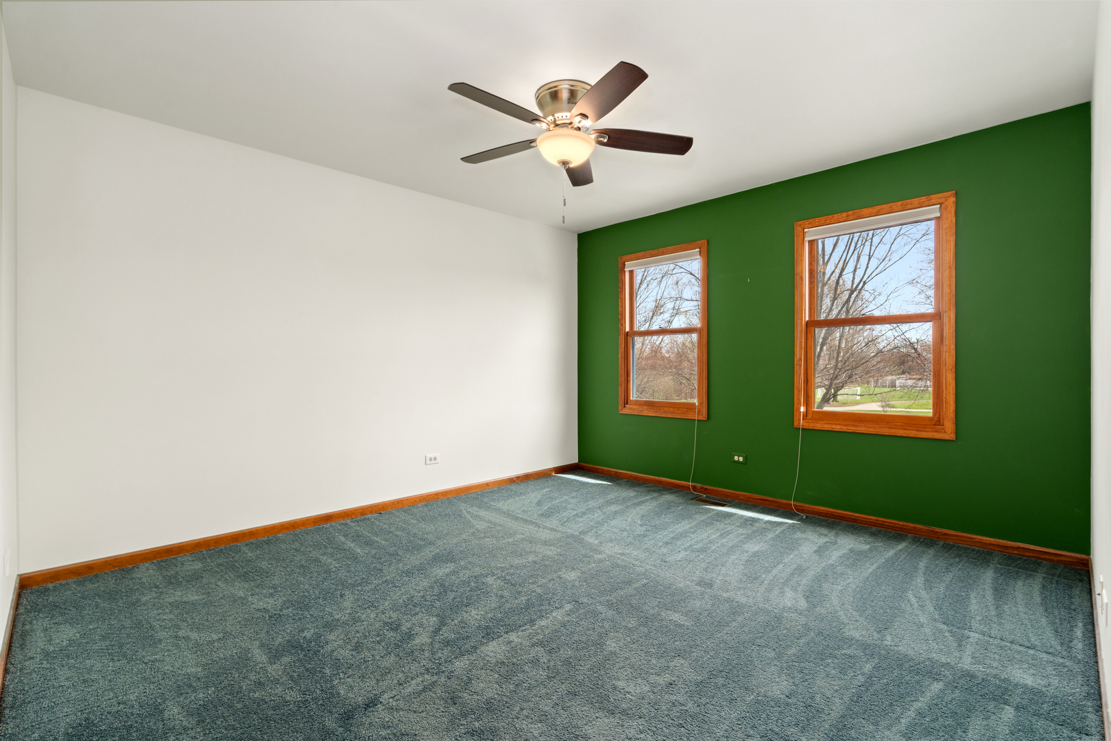 225 Fairway Drive Prospect Heights, IL 60070 - Photo 38 of 57 an empty room with window and ceiling fan