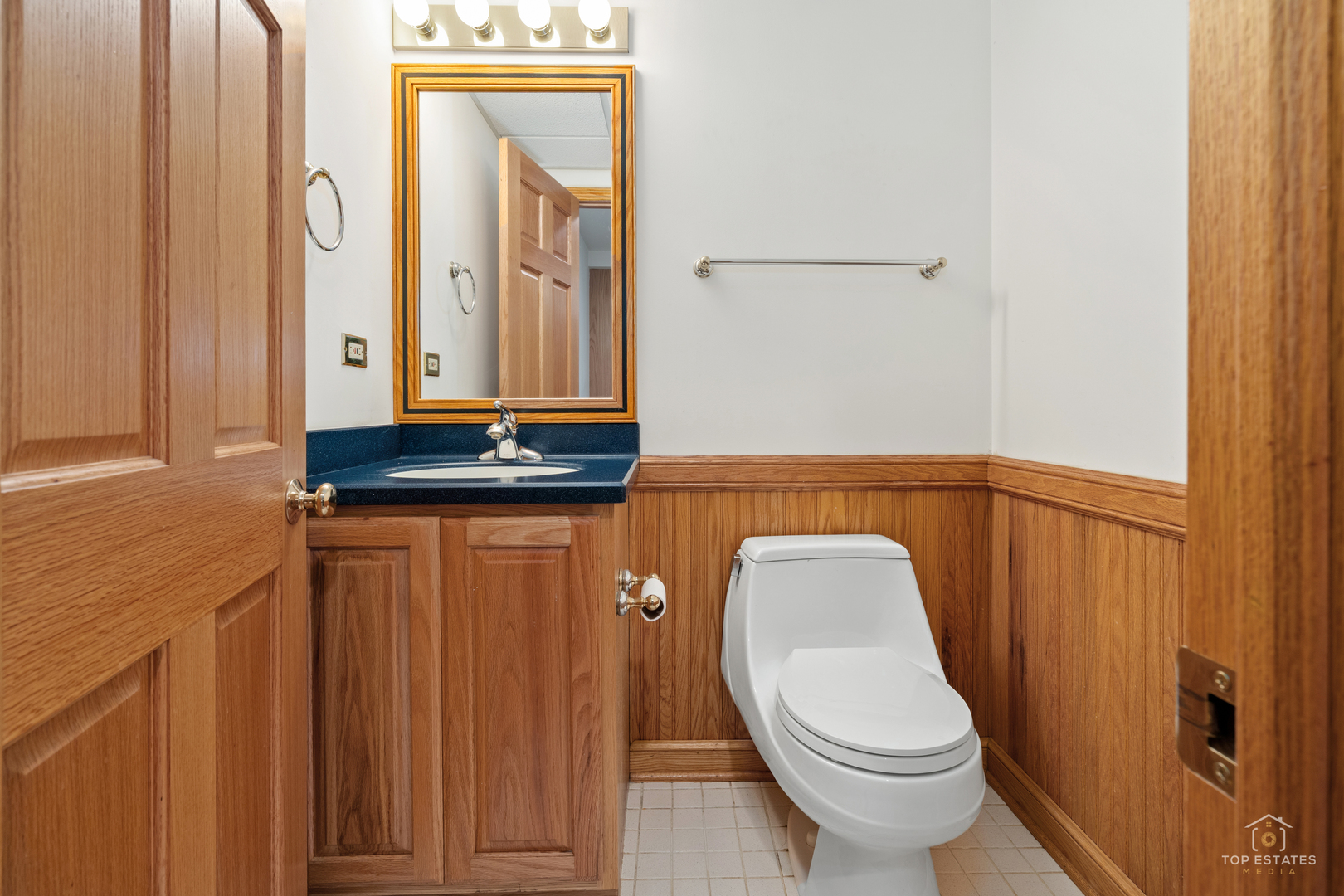 225 Fairway Drive Prospect Heights, IL 60070 - Photo 51 of 57 a bathroom with a toilet a sink and mirror