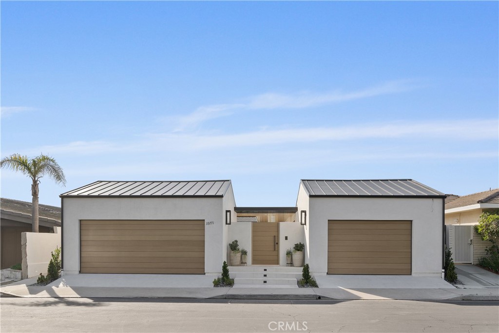 33771 Cabrillo Dana Point, CA 92629 - Photo 1 of 1 a front view of a house with a garage
