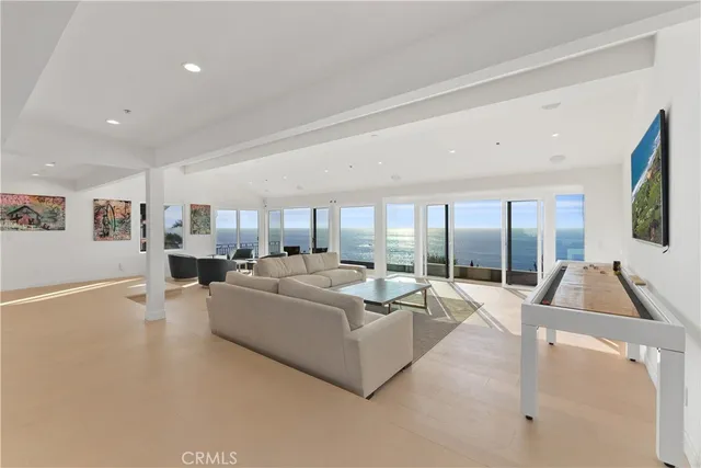 a living room with couch and a large window