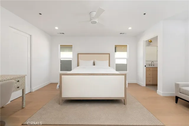 a bedroom with a bed and a night stand