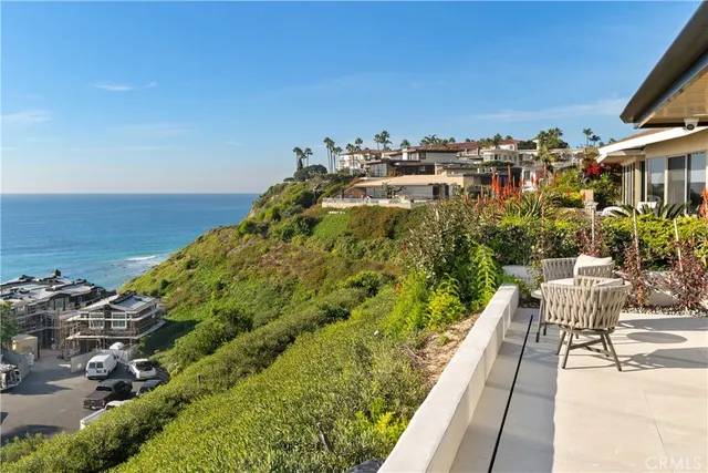 an aerial view of residential building with ocean view
