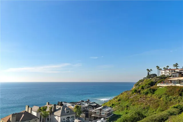 an aerial view of residential building and ocean