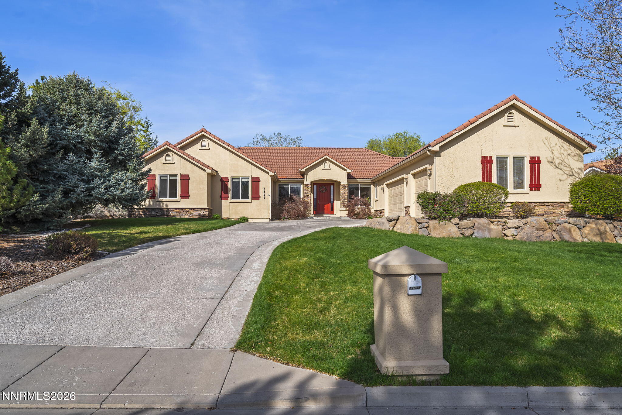 12635 Silver Wolf Road Reno, NV 89511 - Photo 1 of 48 a front view of a house with a yard