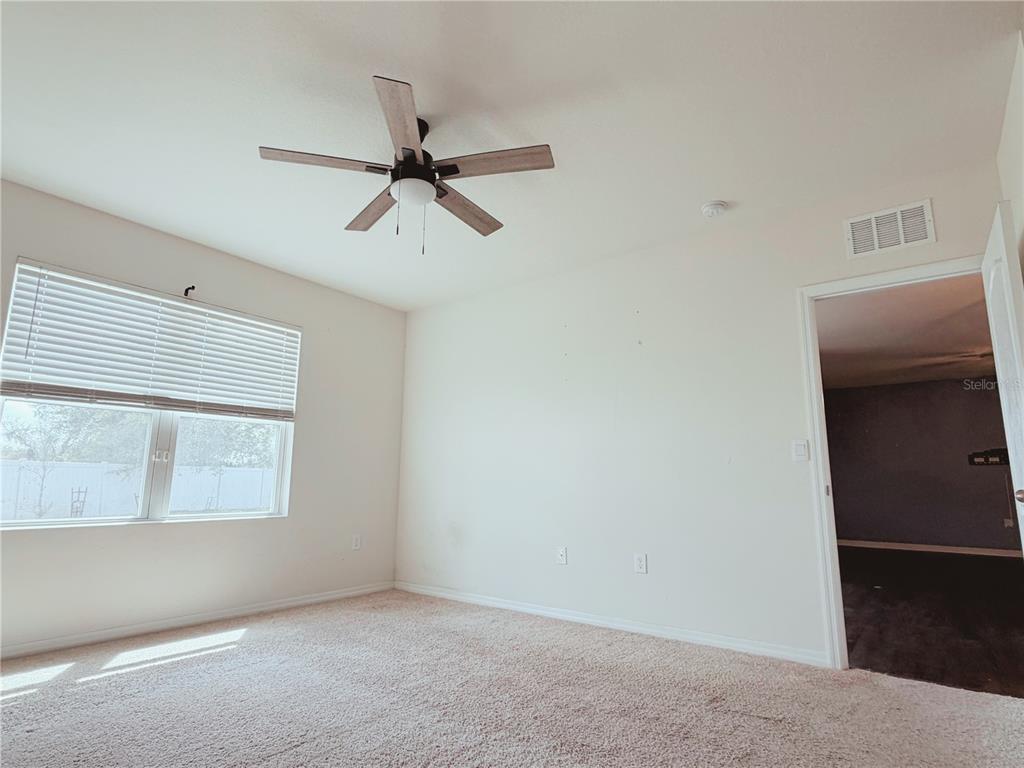 910 Sun Burst Road Winter Haven, FL 33880 - Photo 8 of 14 a view of an empty room with a window