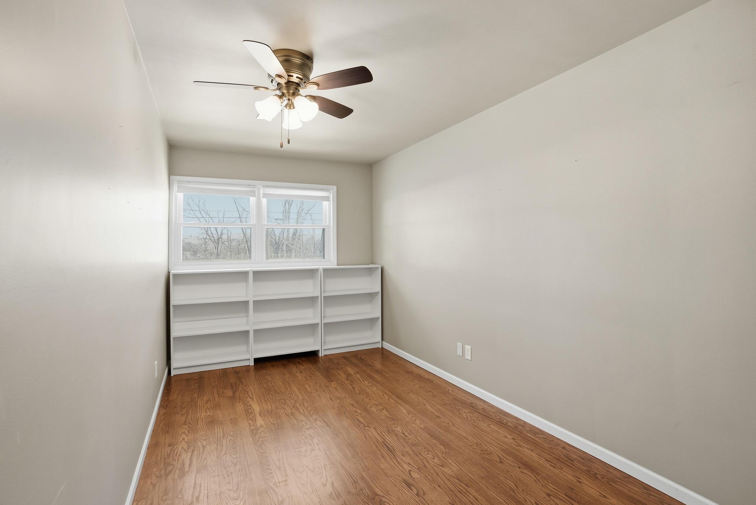 44 Timrick Drive Munster, IN 46321 - Photo 13 of 27 a view of room with a ceiling fan and wooden floor