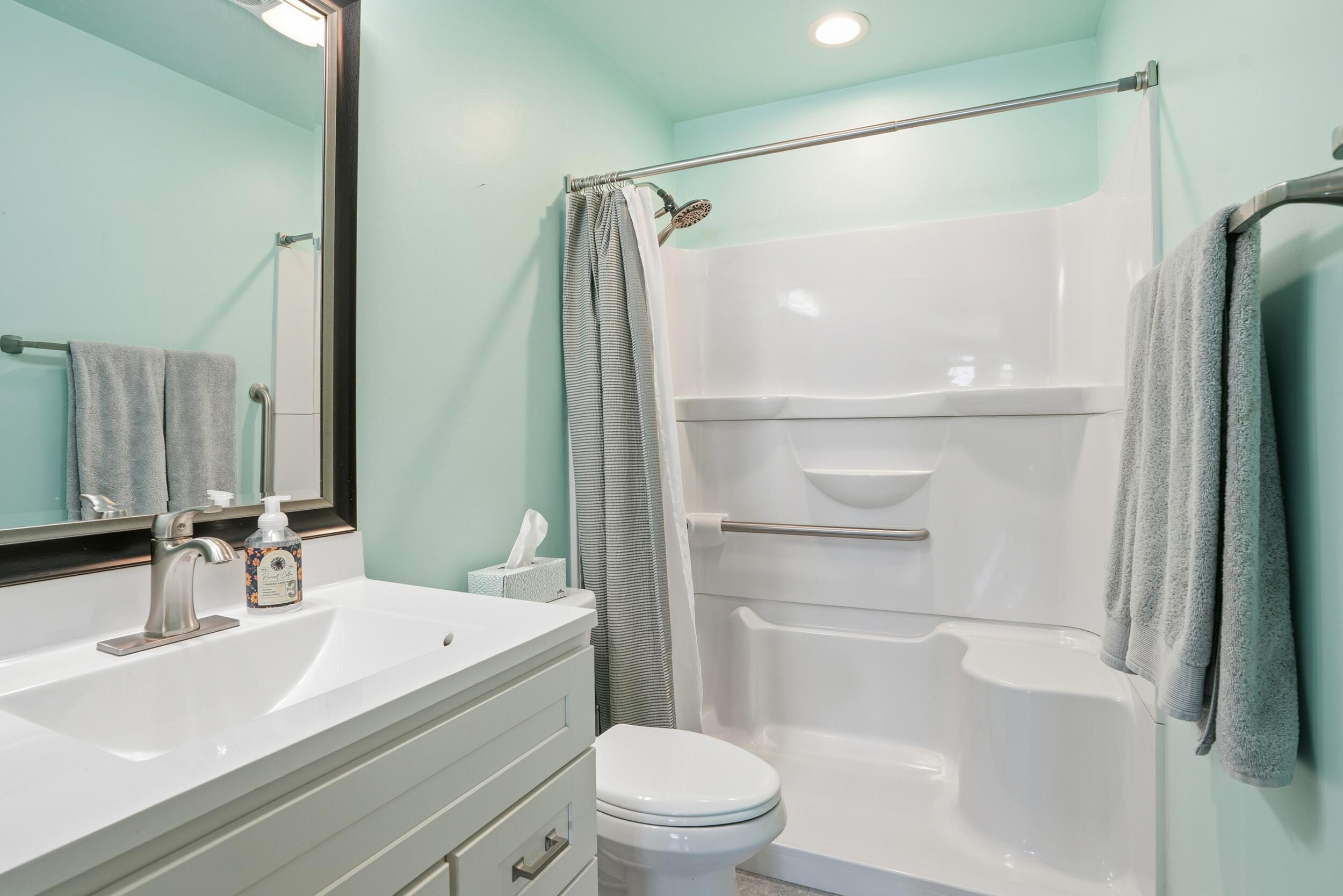 44 Timrick Drive Munster, IN 46321 - Photo 15 of 27 a bathroom with a sink a toilet and a mirror