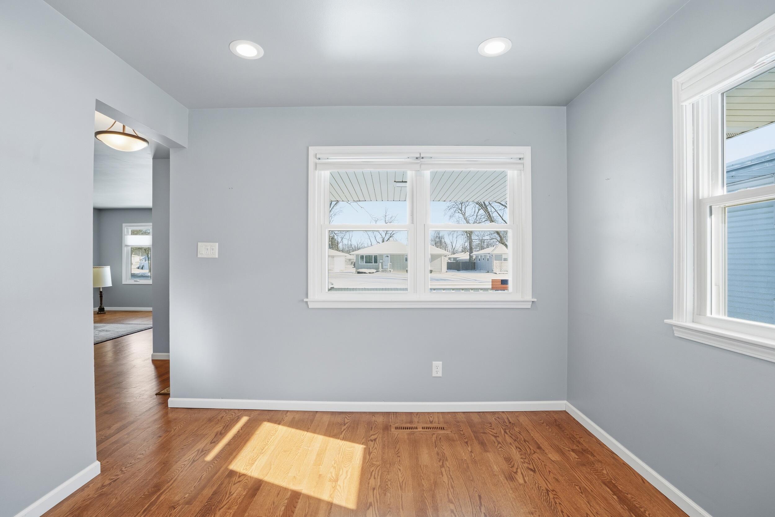 44 Timrick Drive Munster, IN 46321 - Photo 3 of 27 an empty room with wooden floor and windows