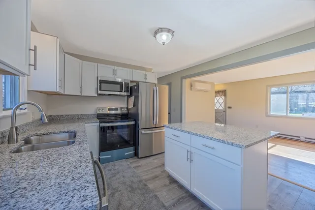 a view living room with a table and chairs