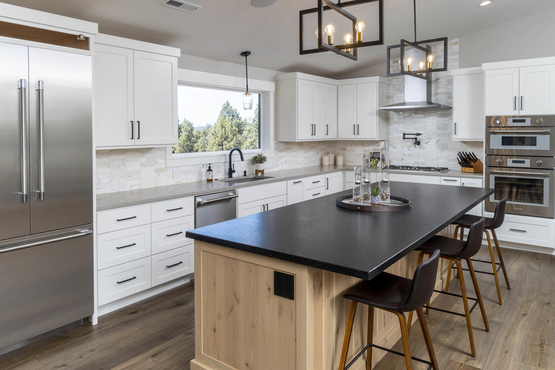 64486 McGrath Road Bend, OR 97701 - Photo 11 of 38 Granite counters on island and wet bar. Quartz counters in kitchen.