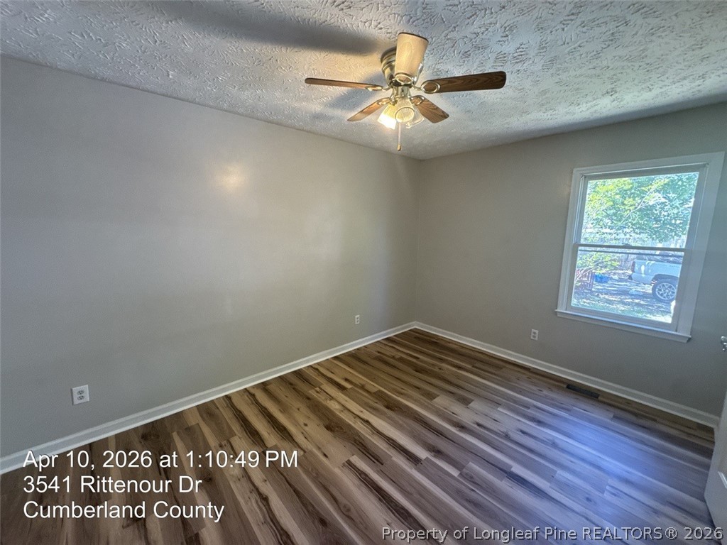 3541 Rittenour Drive Hope Mills, NC 28348 - Photo 13 of 19 a view of room with window and ceiling fan