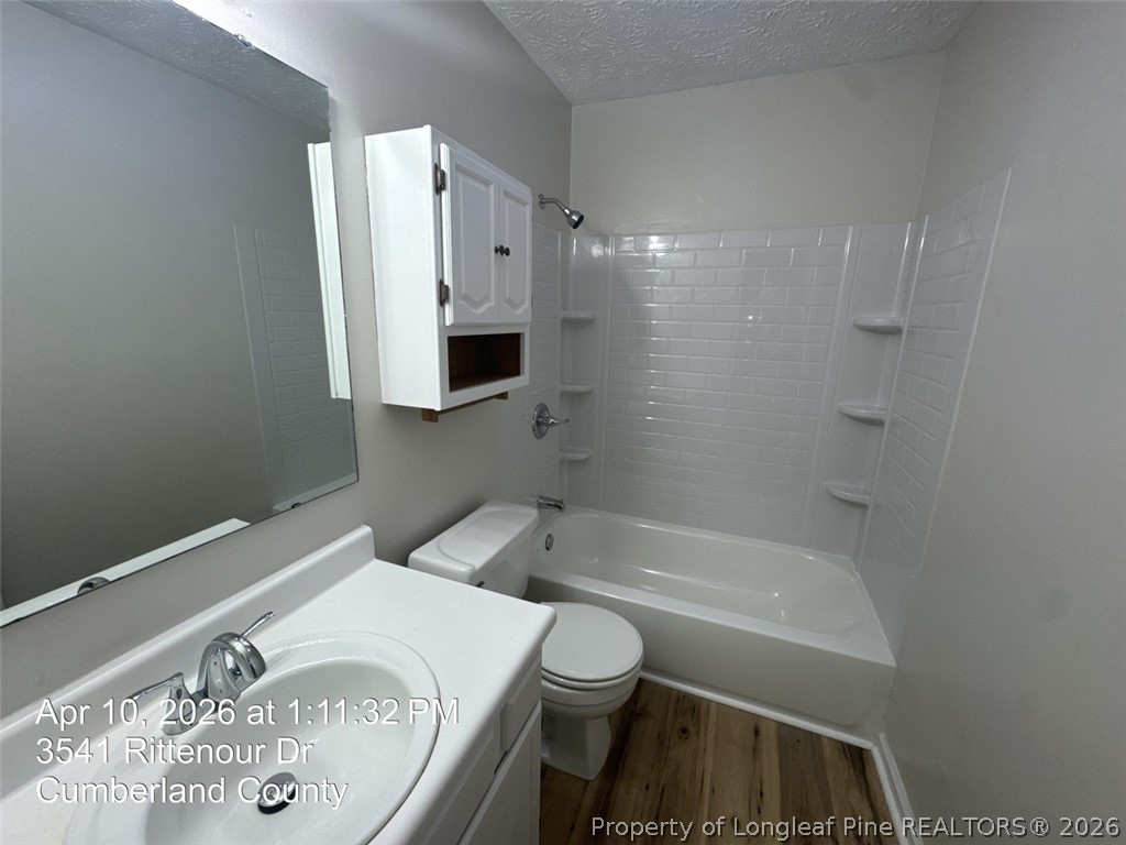 3541 Rittenour Drive Hope Mills, NC 28348 - Photo 17 of 19 a bathroom with a sink a toilet and shower