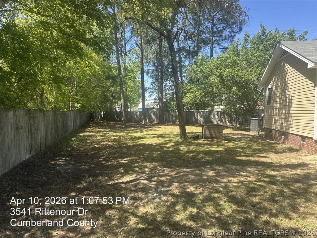 3541 Rittenour Drive Hope Mills, NC 28348 - Photo 3 of 19 a view of a yard with a tree