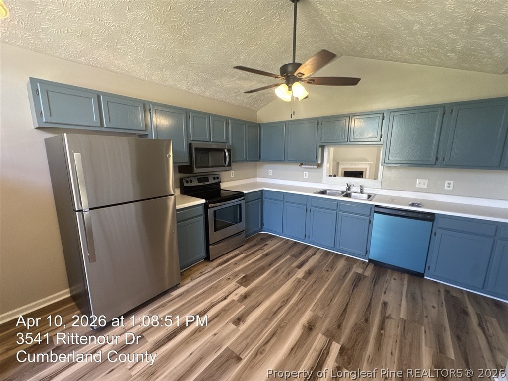3541 Rittenour Drive Hope Mills, NC 28348 - Photo 7 of 19 a kitchen with stainless steel appliances granite countertop a refrigerator sink and stove