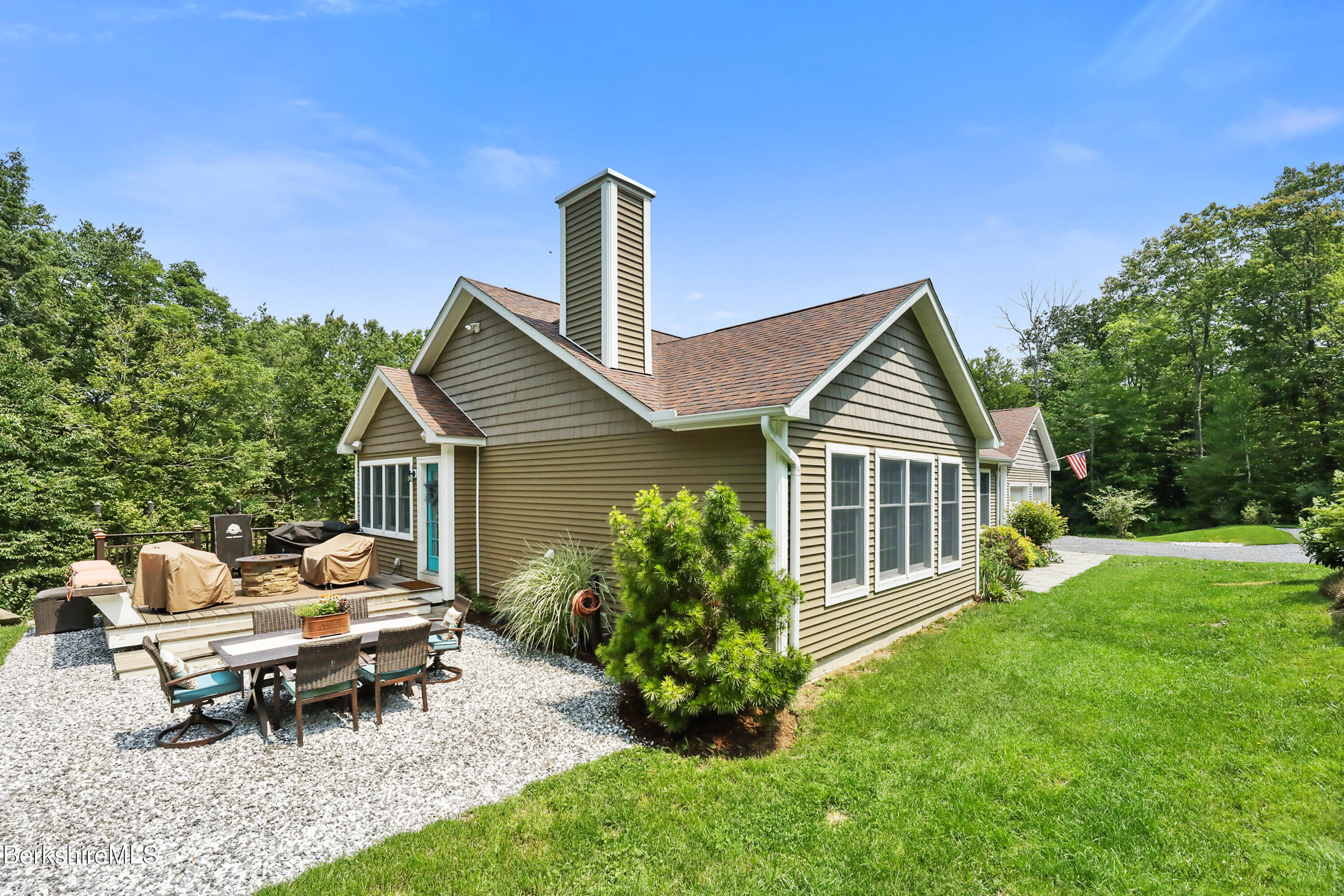71 Goose Pond Road Tyringham, MA 01238 - Photo 3 of 43 a view of a house with a yard and sitting area