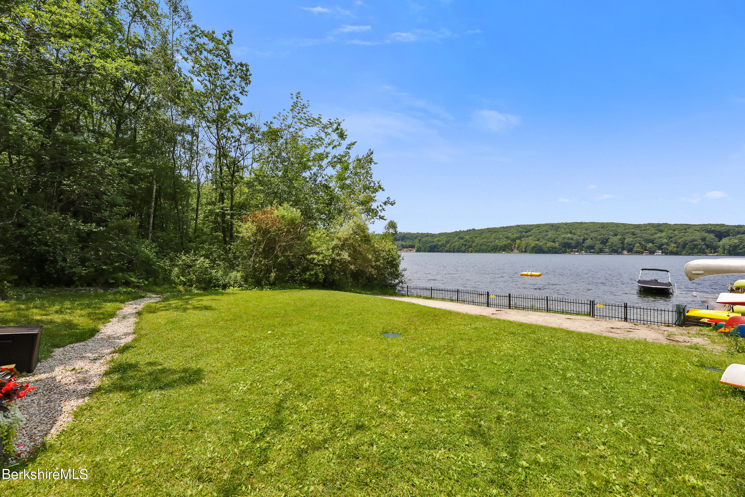 71 Goose Pond Road Tyringham, MA 01238 - Photo 42 of 43 a view of a swimming pool with lawn chairs and a big yard