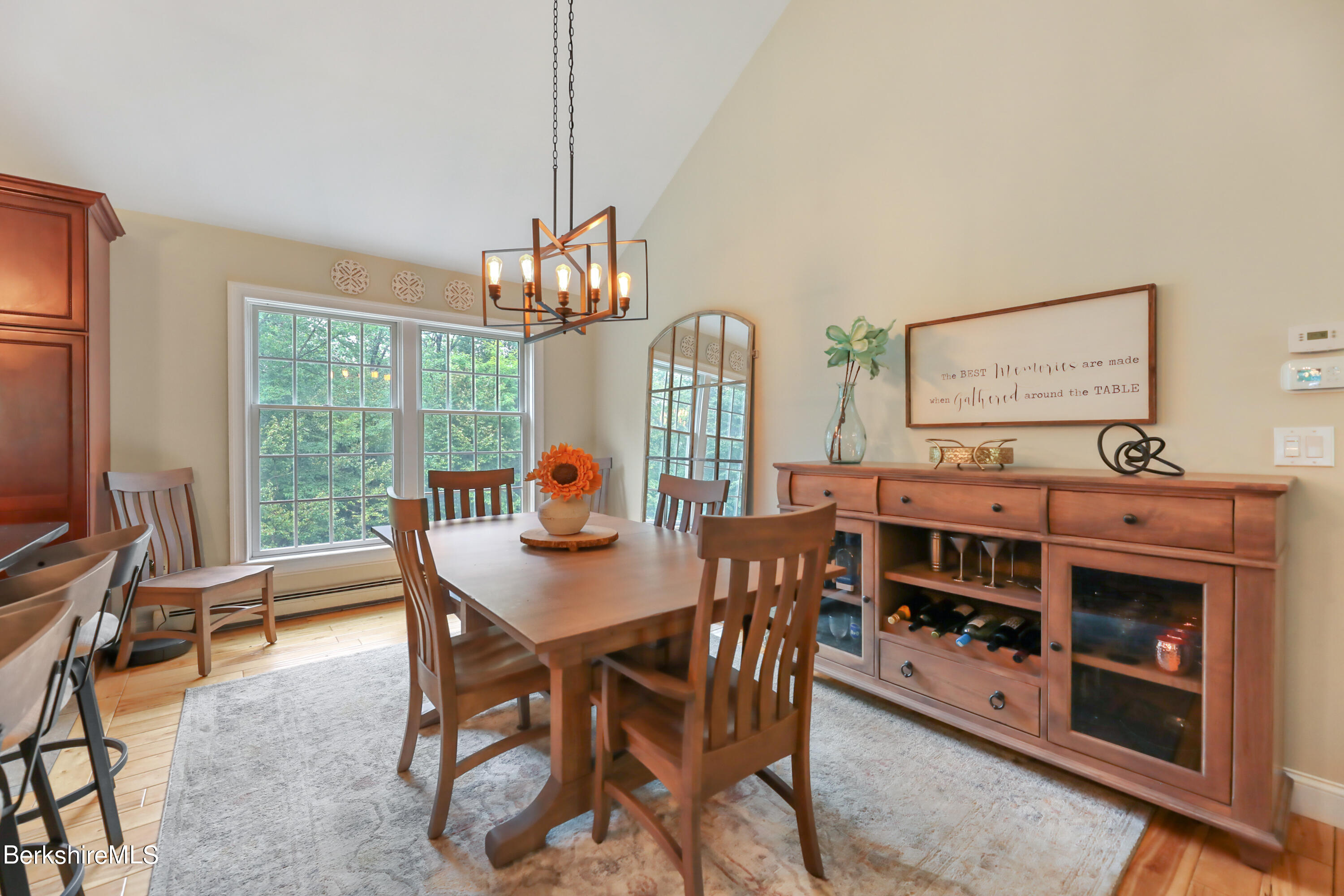 71 Goose Pond Road Tyringham, MA 01238 - Photo 6 of 43 a view of a dining room with furniture window and outside view