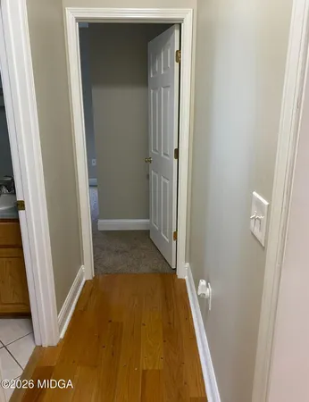 a bathroom with a sink a mirror and a shower