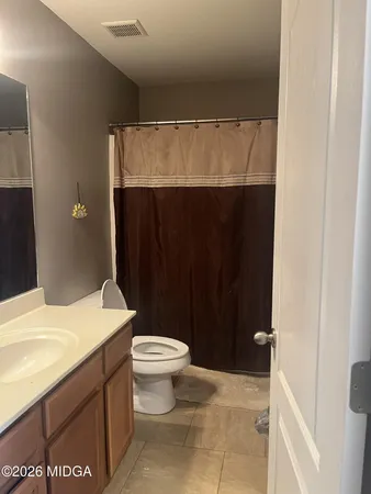 a view of a dining room with furniture and window