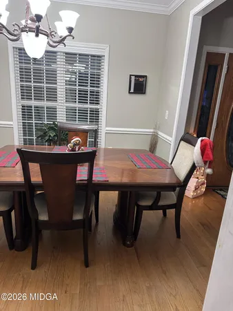 a white toilet sitting next to a shower