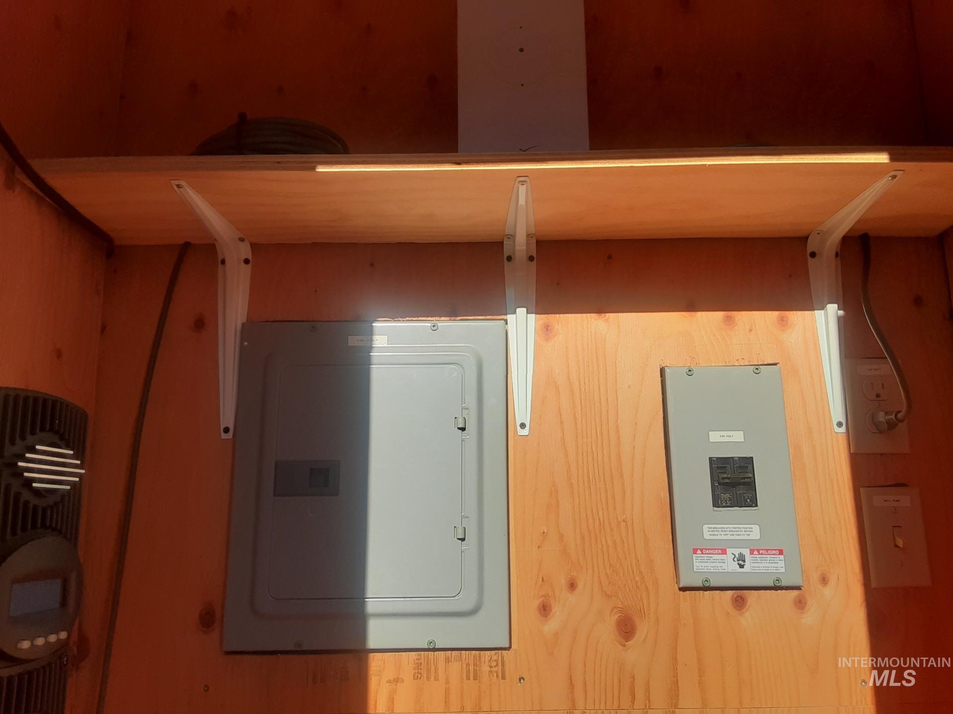 2074 Fleck Smt Road Fairfield, ID 83327 - Photo 15 of 22 Utility room featuring electric panel