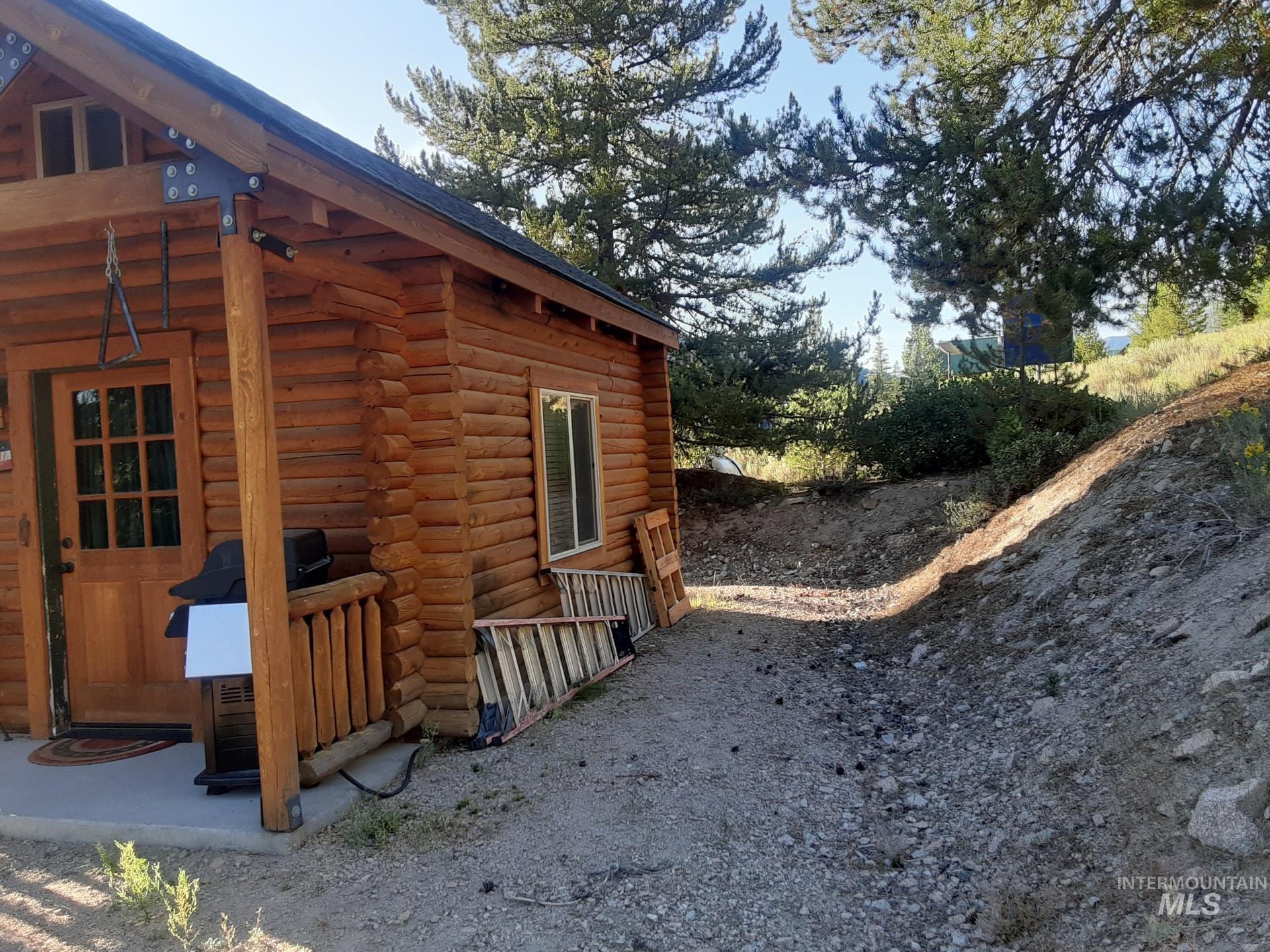 2074 Fleck Smt Road Fairfield, ID 83327 - Photo 3 of 22 View of property exterior featuring log exterior