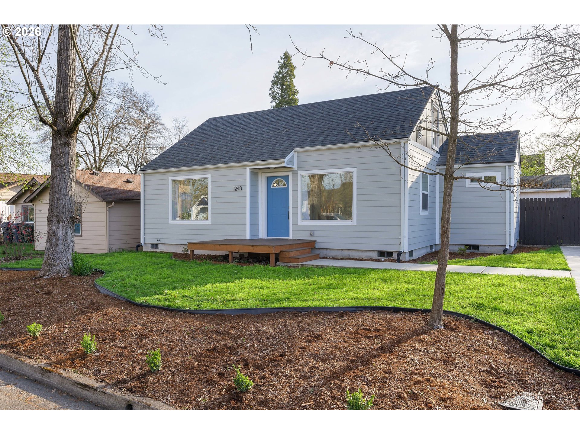 1243 Hayes Street Eugene, OR 97402 - Photo 1 of 48 a view of a house with a yard