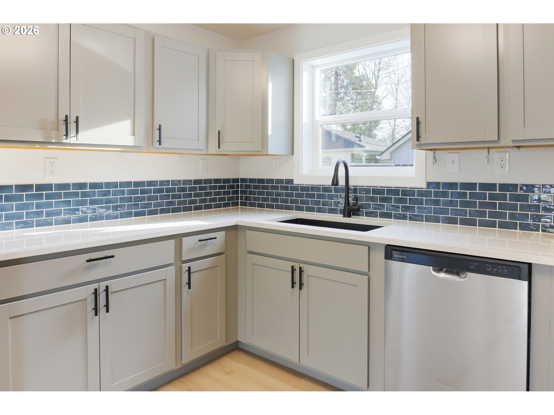 1243 Hayes Street Eugene, OR 97402 - Photo 19 of 48 a kitchen with a sink cabinets and window