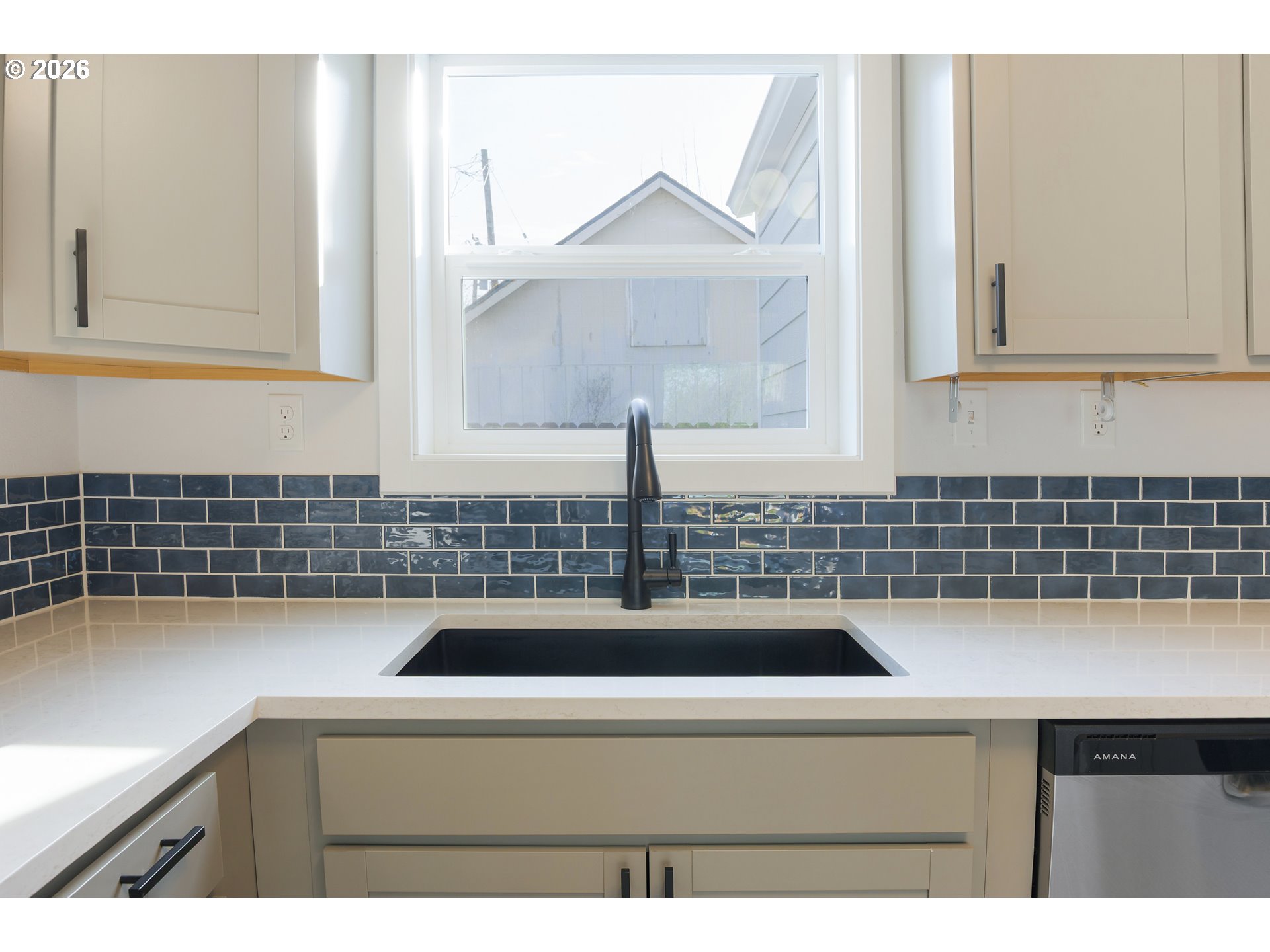 1243 Hayes Street Eugene, OR 97402 - Photo 20 of 48 a kitchen with a sink and a stove top oven