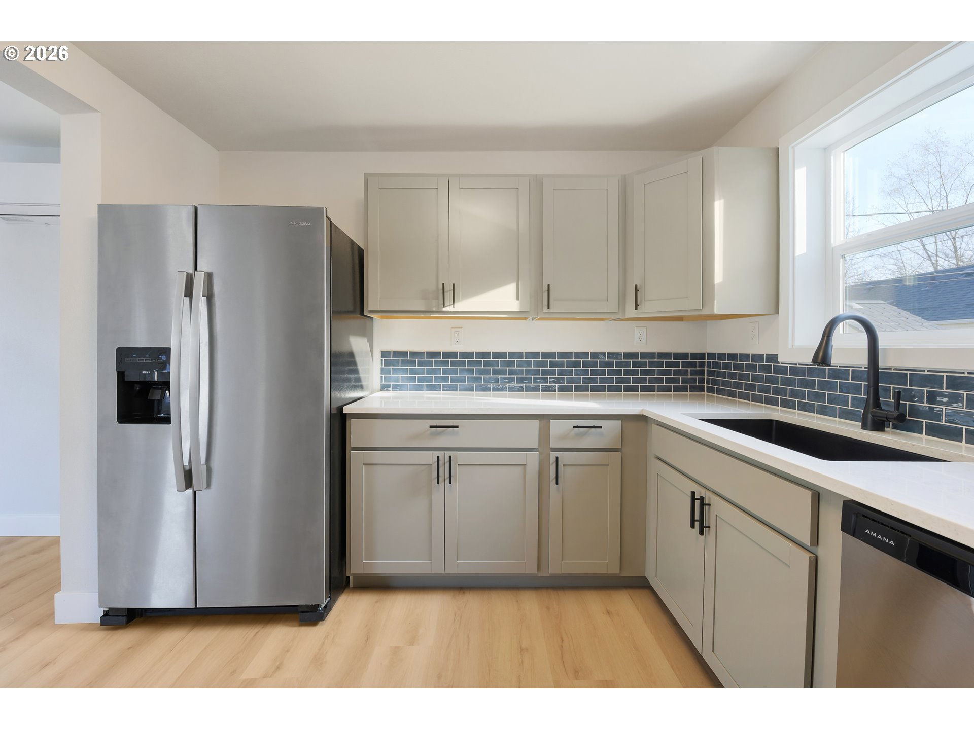 1243 Hayes Street Eugene, OR 97402 - Photo 22 of 48 a kitchen with a refrigerator sink and cabinets