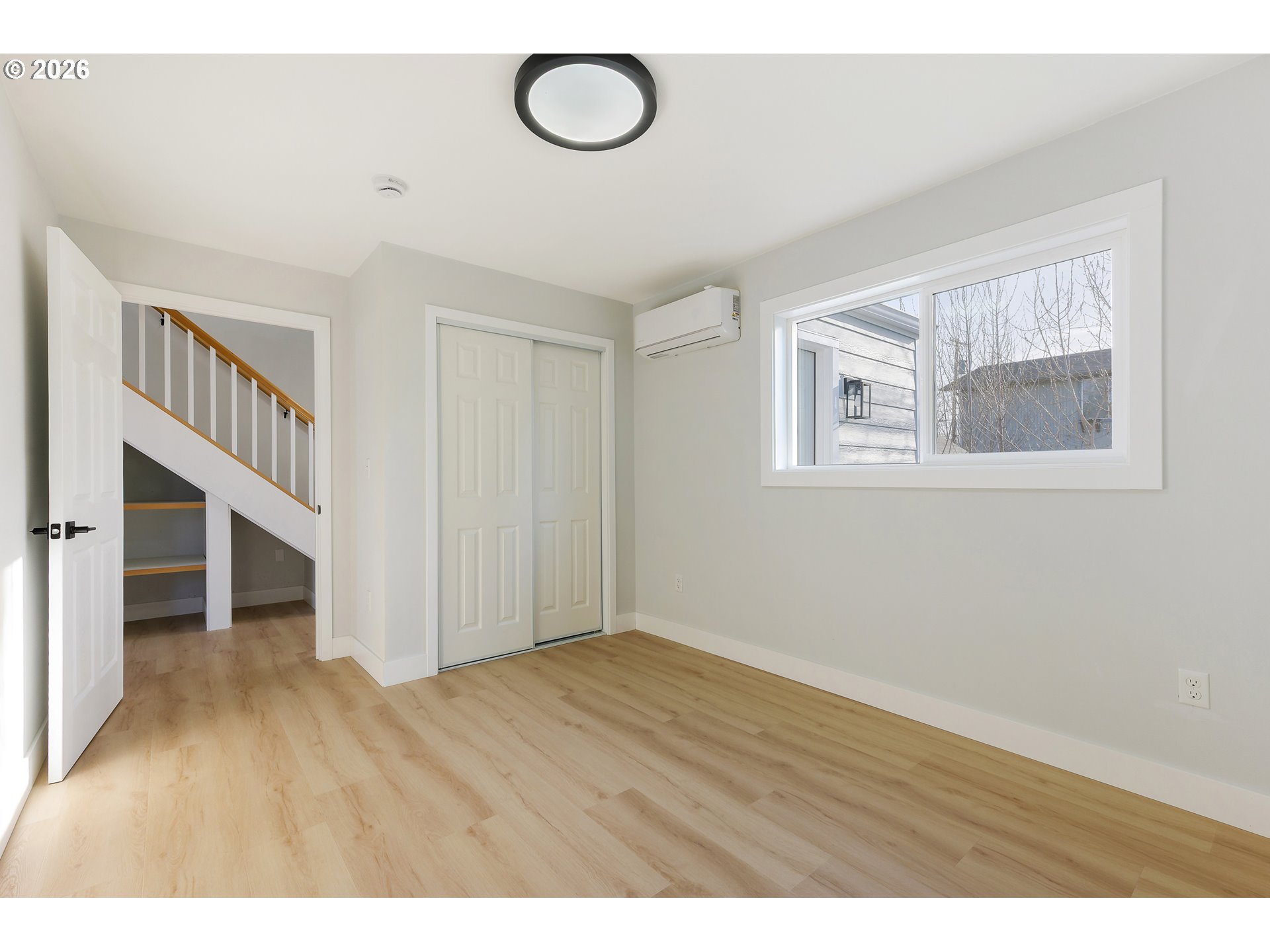 1243 Hayes Street Eugene, OR 97402 - Photo 29 of 48 a view of an empty room with wooden floor and a window
