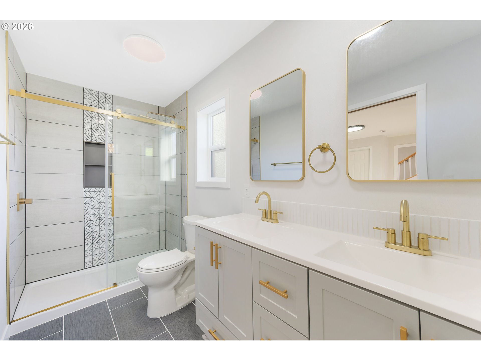 1243 Hayes Street Eugene, OR 97402 - Photo 31 of 48 a bathroom with a sink a toilet a shower and a mirror