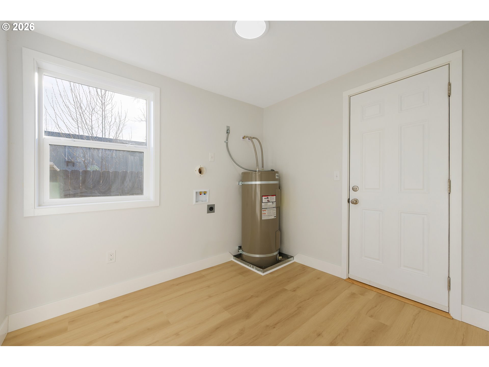 1243 Hayes Street Eugene, OR 97402 - Photo 33 of 48 a view of an empty room with wooden floor and a window
