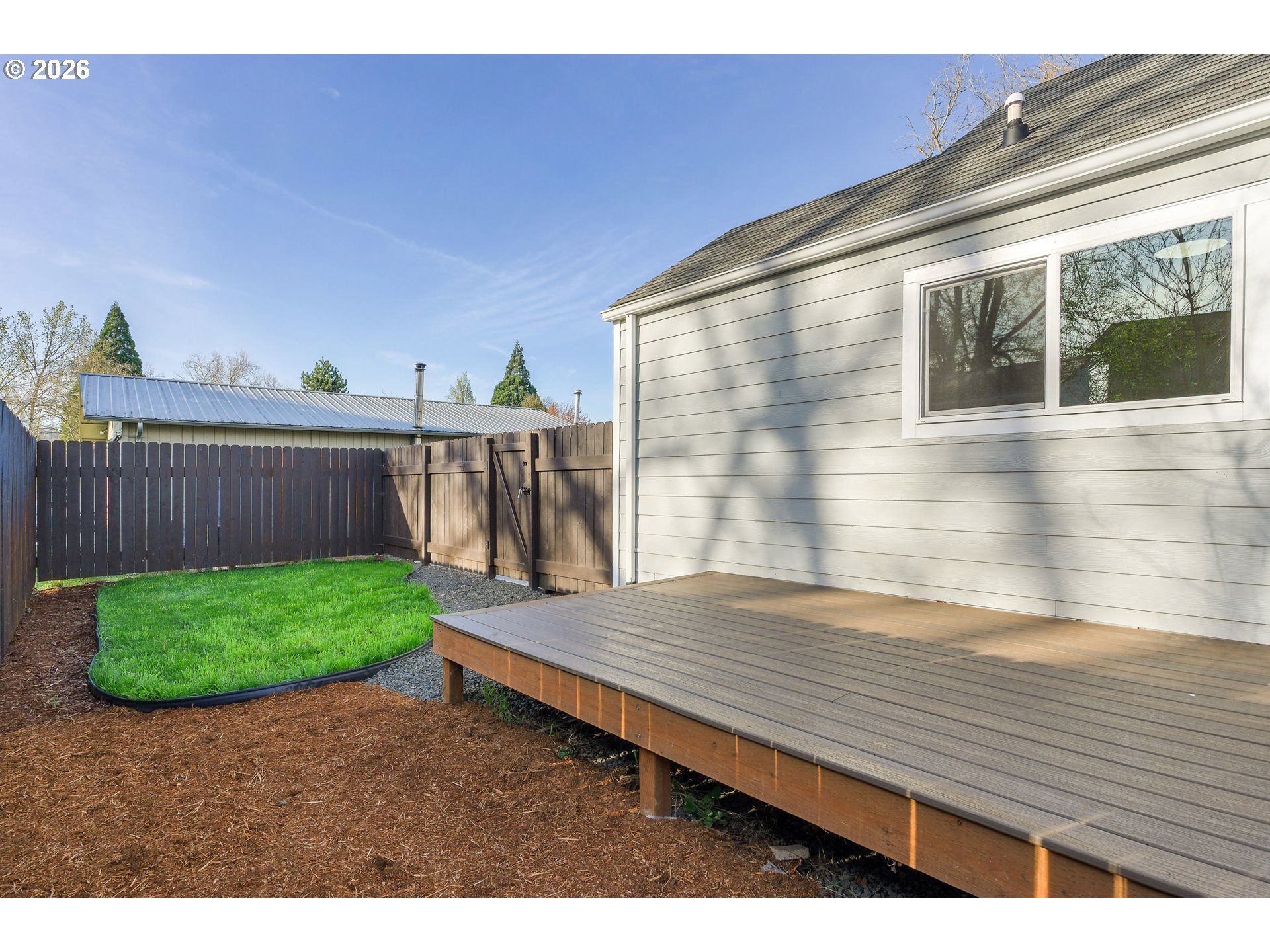 1243 Hayes Street Eugene, OR 97402 - Photo 45 of 48 a view of a backyard with wooden fence