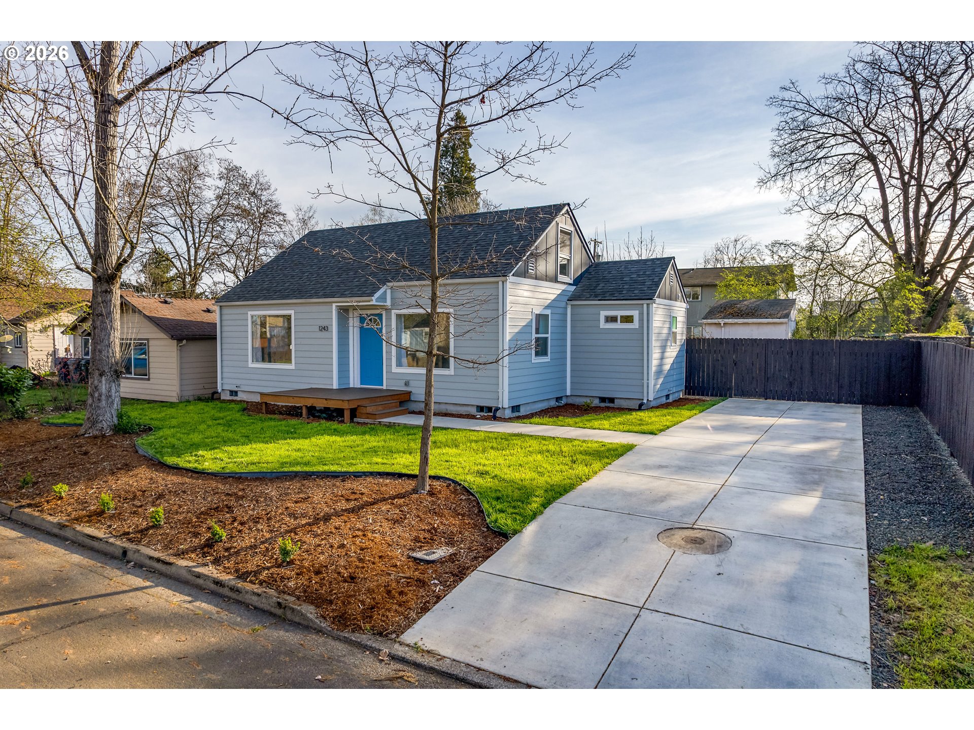 1243 Hayes Street Eugene, OR 97402 - Photo 46 of 48 a view of a house with a yard and large tree