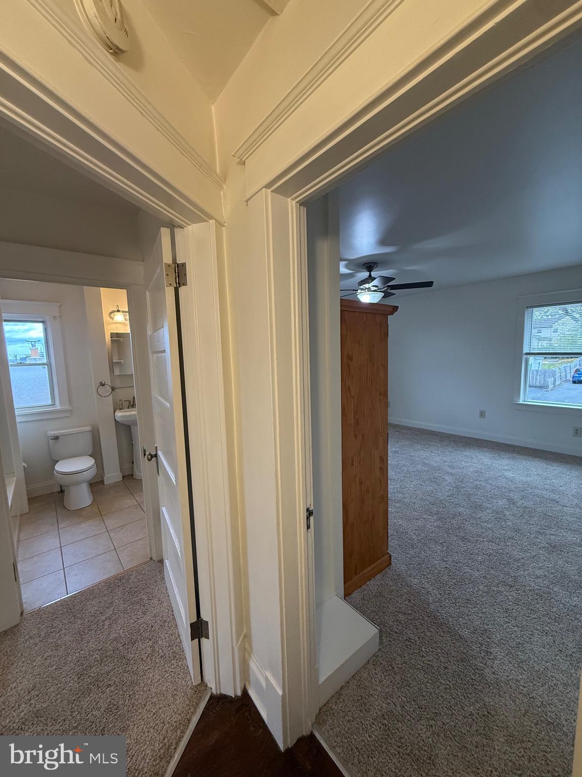1740 Arnold Avenue Willow Grove, PA 19090 - Photo 15 of 22 a view of a hallway with wooden floor and a living room