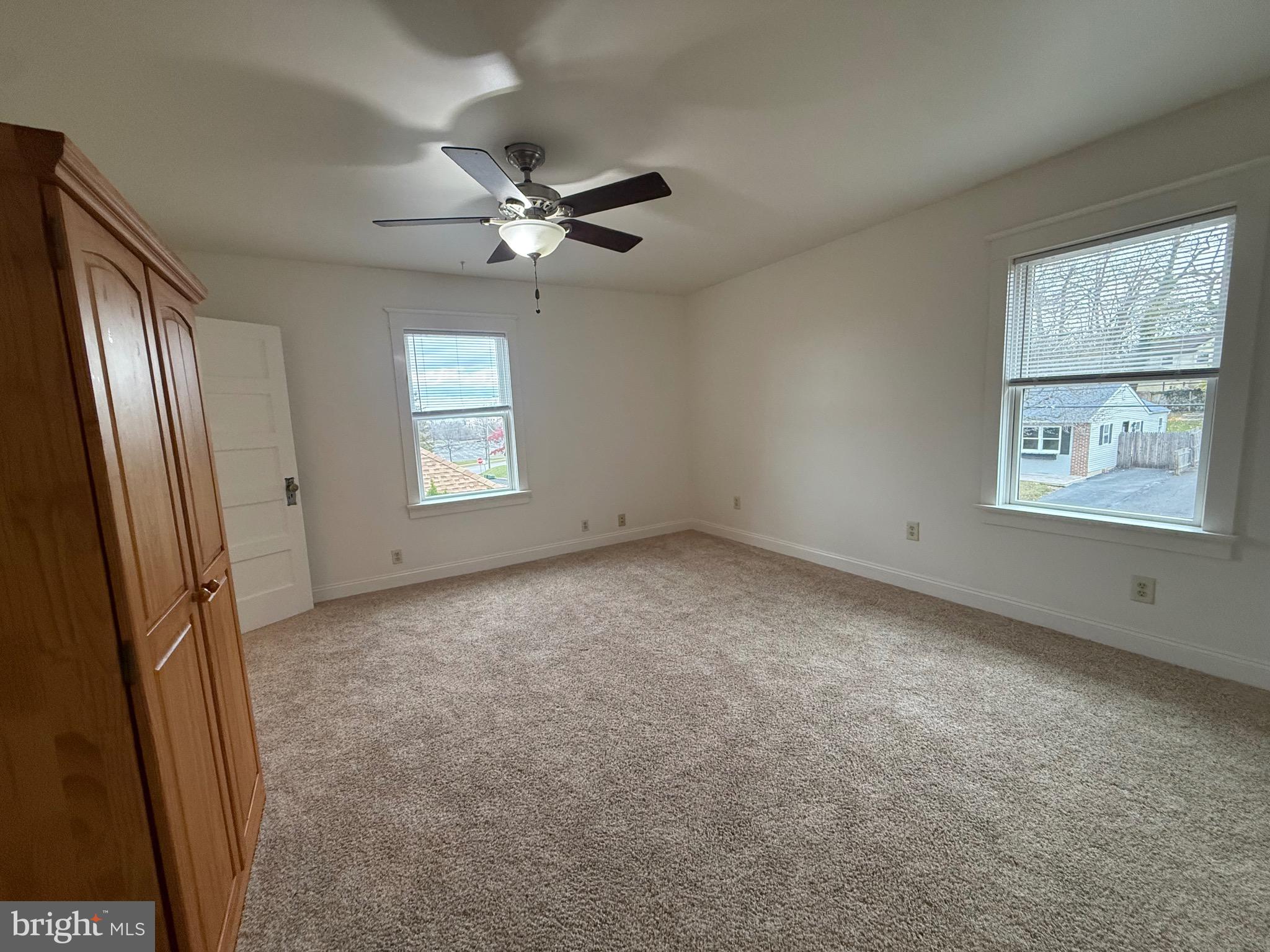 1740 Arnold Avenue Willow Grove, PA 19090 - Photo 16 of 22 an empty room with windows and cabinet
