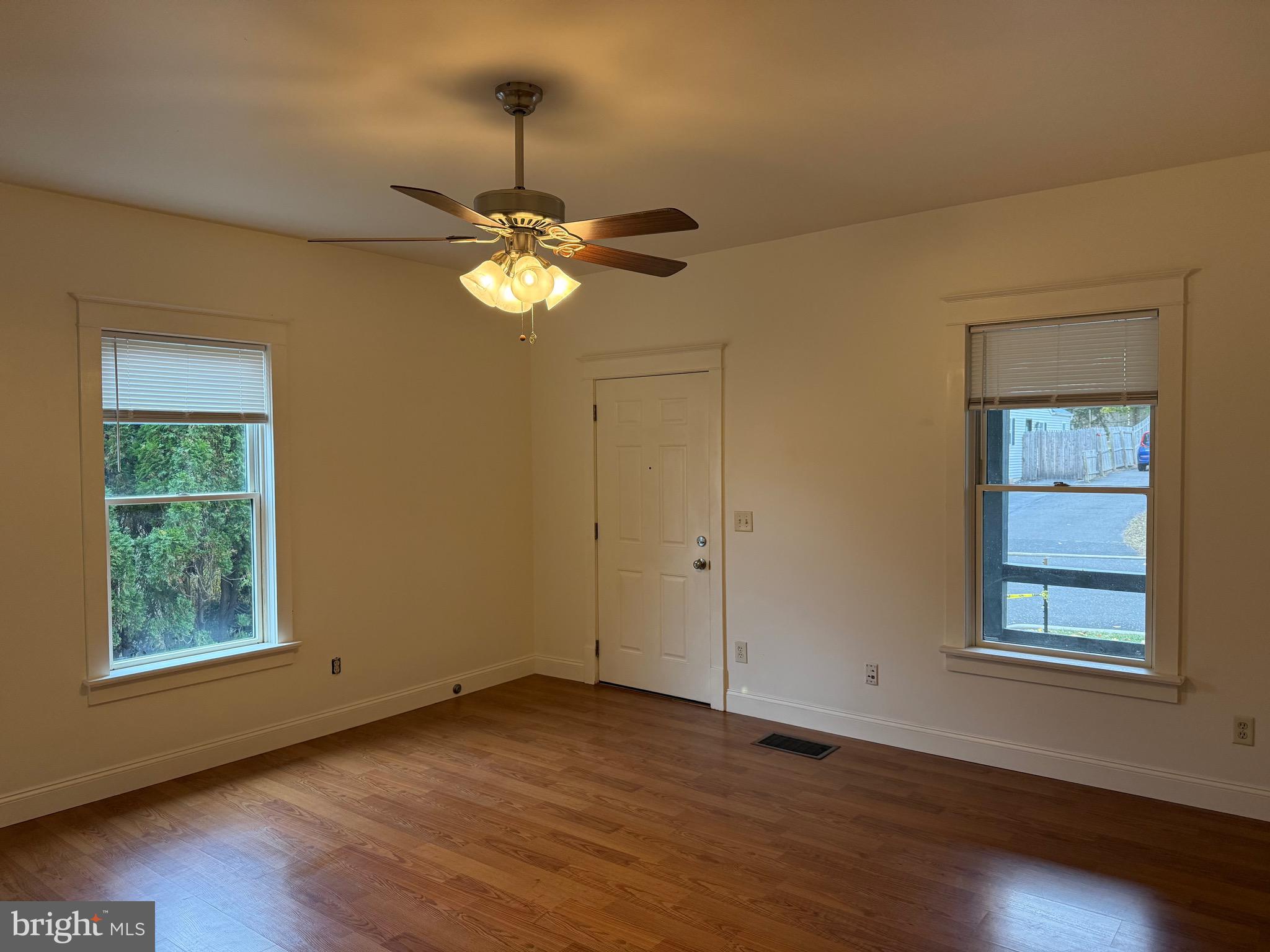 1740 Arnold Avenue Willow Grove, PA 19090 - Photo 2 of 22 a view of an empty room with a window and wooden floor